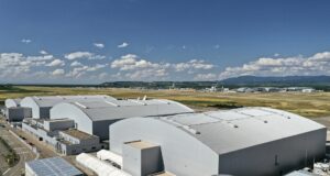 AMAC Aerospace facility with EuroAirport Basel in the background